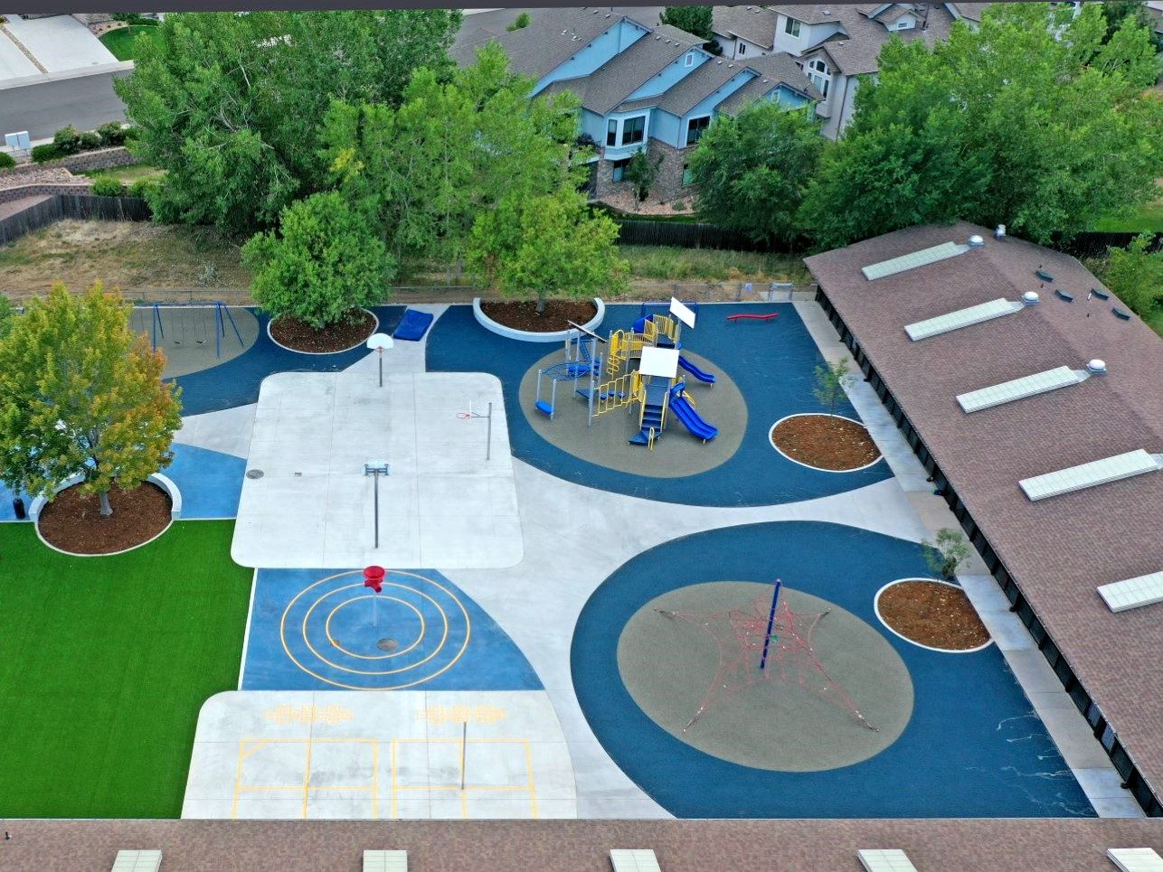 Aerial view of the renovated student drop-off area and playground at Woodrow Wilson Academy